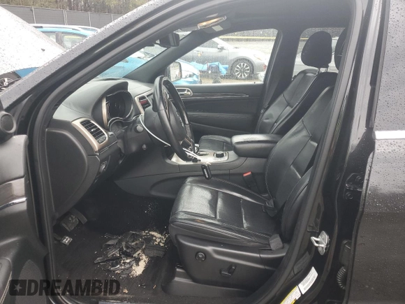 2014 Jeep Grand Cherokee Overland with VIN 1C4RJFCG1EC587458, listed as a Copart auction lot 50213015 with 124,266 mi miles and Salvage Title. Bid and sale history available at carsss.com. Image 7.