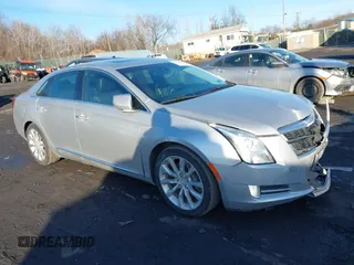 2016 Cadillac XTS Luxury Collection with VIN 2G61N5S36G9140048, listed as a IAAI auction lot 41541106 with 128,868 mi miles. Bid and sale history available at carsss.com. Image 1.