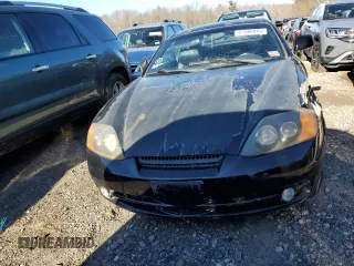 2003 Hyundai Tiburon GT z VIN KMHHN65F83U101784, wystawiony jako Copart lot #41566805 z przebiegiem 99 970 mil mil oraz Nie do naprawy • Non repairable. Historia ofert i sprzedaży dostępna na DreamBid. Obrazek 5.