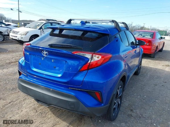 2019 Toyota C-HR XLE with VIN NMTKHMBX2KR091404, listed as a IAAI auction lot 41825675 with 64,255 mi miles. Bid and sale history available at carsss.com. Image 4.
