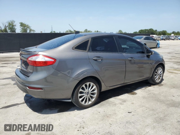 2014 Ford Fiesta SE z VIN 3FADP4BJ4EM110277, wystawiony jako Copart lot #56921115 z przebiegiem 126 536 mil mil oraz Szkoda całkowita • Salvage title. Historia ofert i sprzedaży dostępna na DreamBid. Obrazek 3.