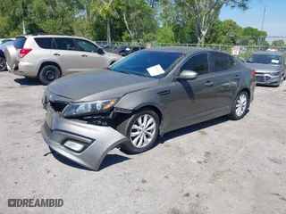 2015 Kia Optima EX with VIN 5XXGN4A73FG413136, listed as a IAAI auction lot 41843651 with 123,716 mi miles. Bid and sale history available at carsss.com. Image 2.