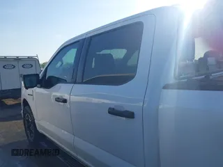 2023 Ford F-150 Lightning Pro with VIN 1FTVW1EL6PWG34059, listed as a IAAI auction lot 42010900 with 20,759 mi miles and . Bid and sale history available at DreamBid. Image 14.