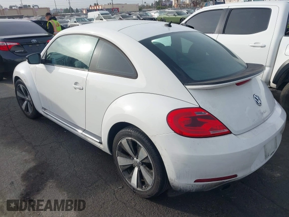 2012 Volkswagen Beetle 2.0T Turbo w/Sun/Snd/Nav PZEV with VIN 3VWVA7ATXCM620731, listed as a IAAI auction lot 41074530 with 99,236 mi miles. Bid and sale history available at carsss.com. Image 3.