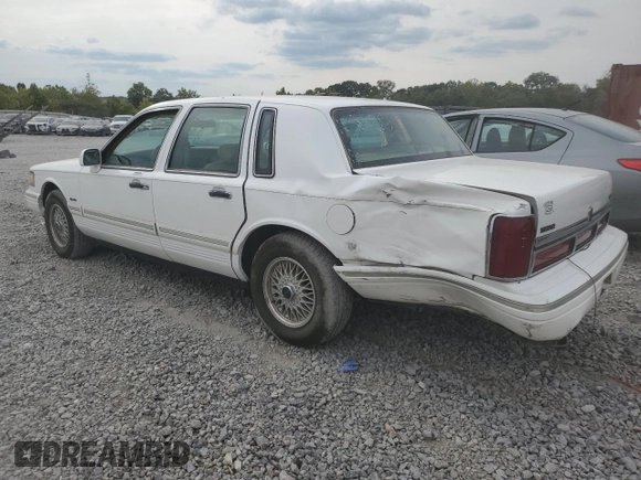 1997 Lincoln Town Car Signature z VIN 1LNLM82W2VY697709, wystawiony jako Copart lot #70506934 z przebiegiem 200 288 mil mil oraz Szkoda całkowita • Salvage title. Historia ofert i sprzedaży dostępna na DreamBid. Obrazek 2.