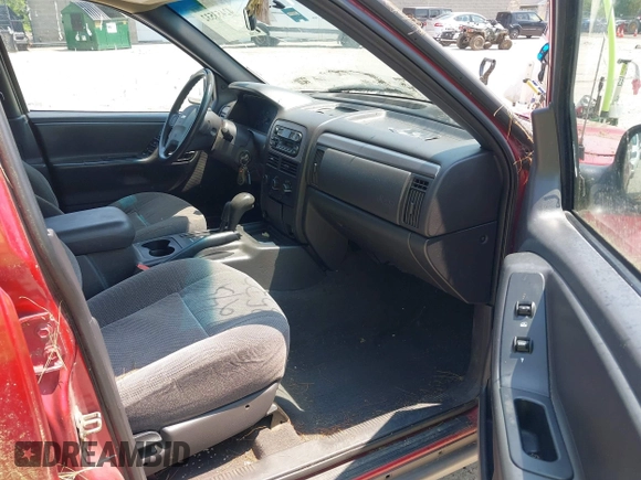 2001 Jeep Grand Cherokee Laredo z VIN 1J4GW48S11C720055, wystawiony jako IAAI lot #42453532 z przebiegiem 158 486 mil mil oraz . Historia ofert i sprzedaży dostępna na DreamBid. Obrazek 5.