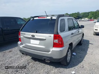 2009 Kia Sportage LX with VIN KNDJF724097567972, listed as a IAAI auction lot 42101204 with 221,299 mi miles. Bid and sale history available at carsss.com. Image 4.