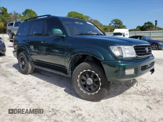 2000 Toyota Land Cruiser with VIN JT3HT05J8Y0085990, listed as a Copart auction lot 76706864 with 329,562 mi miles and Salvage Title. Bid and sale history available at carsss.com. Image 4.