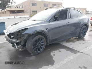 2021 Tesla Model Y Long Range with VIN 5YJYGAEE0MF223140, listed as a IAAI auction lot 42007701 with 55,308 mi miles. Bid and sale history available at carsss.com. Image 22.