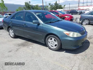 2002 Toyota Camry XLE z VIN 4T1BF32K72U537897, wystawiony jako IAAI lot #42002893 z przebiegiem 264 179 mil mil oraz . Historia ofert i sprzedaży dostępna na DreamBid. Obrazek 1.