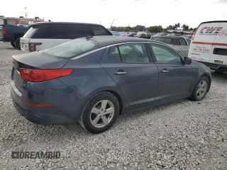 2015 Kia Optima LX z VIN KNAGM4A75F5590016, wystawiony jako Copart lot #48321155 z przebiegiem 112 720 mil mil oraz Czysty tytuł • Clean title. Historia ofert i sprzedaży dostępna na DreamBid. Obrazek 3.