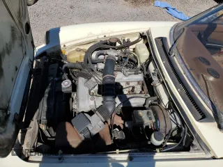 1983 Alfa Romeo Spider Veloce z VIN ZARBA5419D1016371, wystawiony jako Copart lot #71136854 z przebiegiem 78 432 mil mil oraz Szkody całkowita. Historia ofert i sprzedaży dostępna na DreamBid. Obrazek 11.