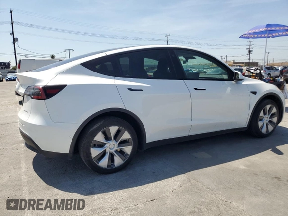 2022 Tesla Model Y Long Range z VIN 7SAYGDEE2NF513823, wystawiony jako Copart lot #51174795 z przebiegiem 28 143 mil mil oraz Szkody całkowita. Historia ofert i sprzedaży dostępna na DreamBid. Obrazek 3.