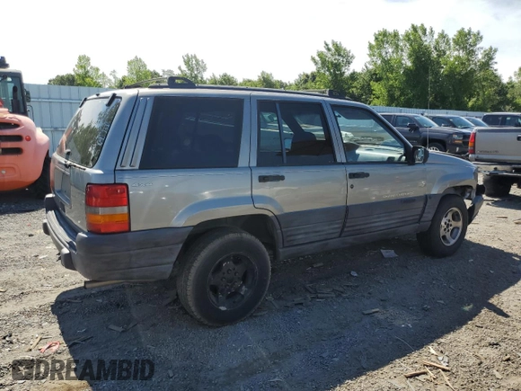 1998 Jeep Grand Cherokee Laredo z VIN 1J4GZ58S4WC278490, wystawiony jako Copart lot #62388535 z przebiegiem 133 896 mil mil oraz Czysty tytuł • Clean title. Historia ofert i sprzedaży dostępna na DreamBid. Obrazek 3.