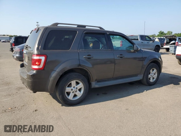 2011 Ford Escape Hybrid with VIN 1FMCU4K35BKA16469, listed as a Copart auction lot 65811905 with 401,583 mi miles and Clean title. Bid and sale history available at DreamBid. Image 3.