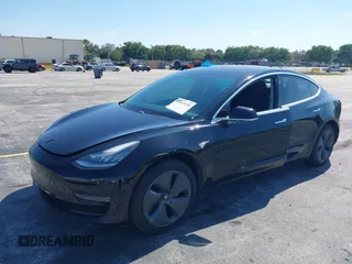 2019 Tesla Model 3 Mid Range with VIN 5YJ3E1EA0KF317058, listed as a IAAI auction lot 42025195 with 108,771 mi miles. Bid and sale history available at carsss.com. Image 2.