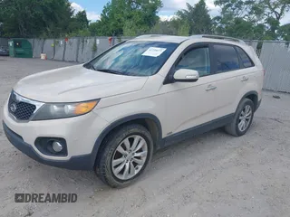 2011 Kia Sorento EX with VIN 5XYKUDA20BG031931, listed as a IAAI auction lot 42234673 with 171,221 mi miles and . Bid and sale history available at DreamBid. Image 2.