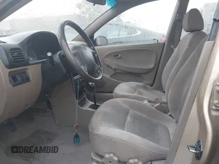 2002 Kia Rio with VIN KNADC123626192611, listed as a IAAI auction lot 41765104 with 62,387 mi miles. Bid and sale history available at carsss.com. Image 5.