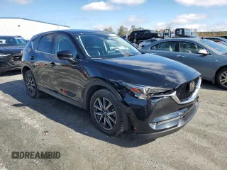 2018 Mazda CX-5 Grand Touring with VIN JM3KFADM5J0325794, listed as a Copart auction lot 79748544 with 106,781 mi miles and Salvage Title. Bid and sale history available at carsss.com. Image 4.