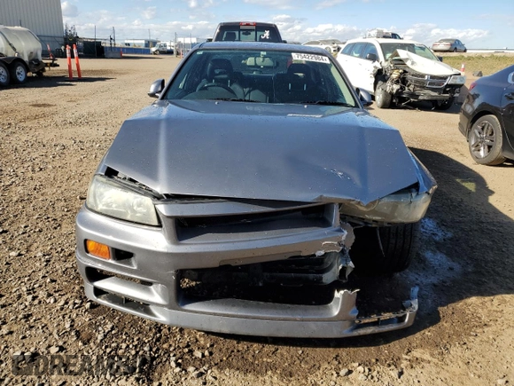 1999 Nissan Skyline z VIN HR34005885, wystawiony jako Copart lot #75422984 z przebiegiem 150 776 mil mil oraz Szkoda całkowita • Salvage title. Historia ofert i sprzedaży dostępna na DreamBid. Obrazek 5.