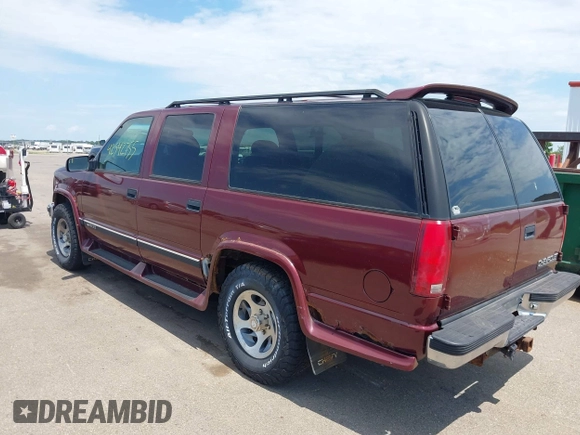 1999 Chevrolet Suburban with VIN 1GBFK16R5XJ335005, listed as a IAAI auction lot 42542755 with 200,599 mi miles and . Bid and sale history available at DreamBid. Image 3.