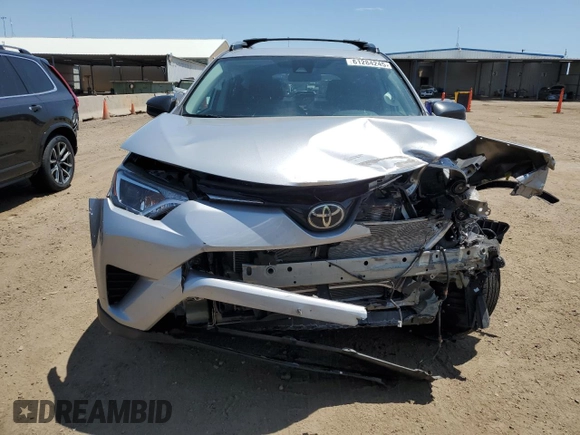 2017 Toyota RAV4 LE with VIN 2T3BFREV7HW561030, listed as a Copart auction lot 61284245 with 90,690 mi miles and Salvage title. Bid and sale history available at DreamBid. Image 5.