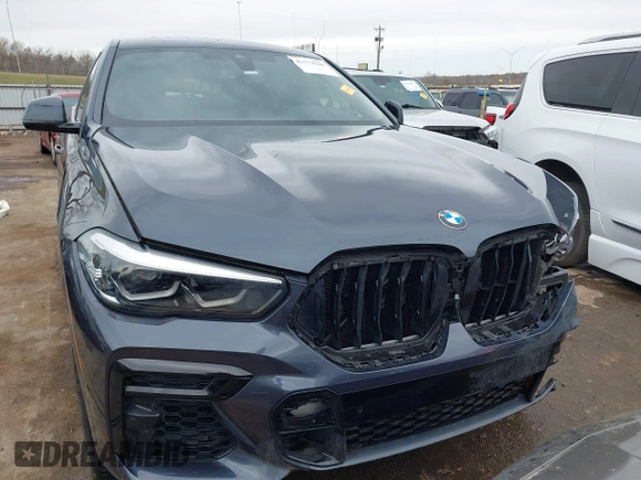 2022 BMW X6 xDrive40i z VIN 5UXCY6C08N9N30013, wystawiony jako IAAI lot #41772245 z przebiegiem 23 198 mil mil oraz . Historia ofert i sprzedaży dostępna na DreamBid. Obrazek 13.