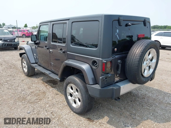 2014 Jeep Wrangler Unlimited Sahara with VIN 1C4BJWEG8EL285843, listed as a IAAI auction lot 42399090 with Not provided miles and . Bid and sale history available at DreamBid. Image 3.