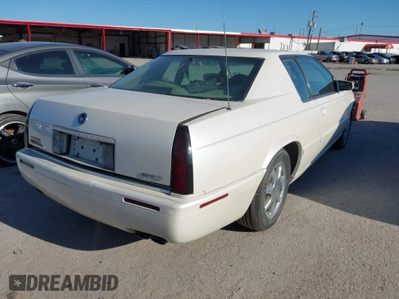 2000 Cadillac Eldorado Touring ETC z VIN 1G6ET1292YU188056, wystawiony jako IAAI lot #41671661 z przebiegiem 139 138 mil mil oraz . Historia ofert i sprzedaży dostępna na DreamBid. Obrazek 4.