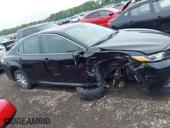 2019 Toyota Camry Hybrid LE z VIN 4T1B31HK5KU510055, wystawiony jako IAAI lot #42325522 z przebiegiem 97 000 mil mil oraz . Historia ofert i sprzedaży dostępna na DreamBid. Obrazek 13.