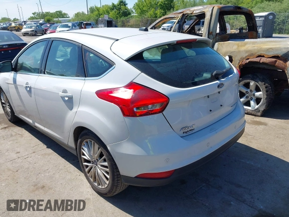 2018 Ford Focus Titanium with VIN 1FADP3N24JL279449, listed as a IAAI auction lot 42297780 with 144,479 mi miles and . Bid and sale history available at DreamBid. Image 3.
