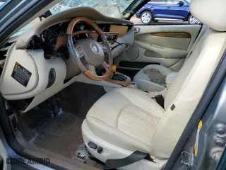 2004 Jaguar X-Type with VIN SAJEA51C34WE19153, listed as a Copart auction lot 77452474 with 0 mi miles and Salvage Title. Bid and sale history available at carsss.com. Image 7.