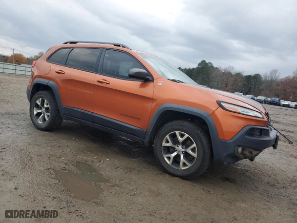 2015 Jeep Cherokee Trailhawk with VIN 1C4PJMBSXFW704942, listed as a Copart auction lot 85514044 with 194,340 mi miles and Salvage Title. Bid and sale history available at carsss.com. Image 4.