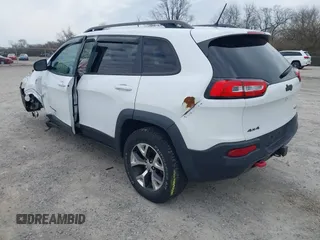 2015 Jeep Cherokee Trailhawk with VIN 1C4PJMBB7FW741365, listed as a IAAI auction lot 41879685 with 94,135 mi miles and . Bid and sale history available at carsss.com. Image 3.