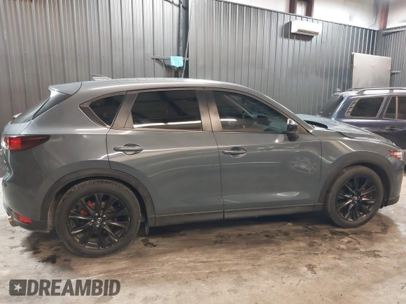 2021 Mazda CX-5 Touring with VIN JM3KFBCM5M0365725, listed as a IAAI auction lot 41411763 with 77,504 mi miles. Bid and sale history available at carsss.com. Image 14.