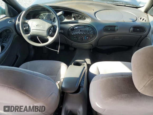 1999 Ford Taurus SE with VIN 1FAFP53U2XG184723, listed as a Copart auction lot 60787115 with 128,277 mi miles and Salvage title. Bid and sale history available at DreamBid. Image 8.