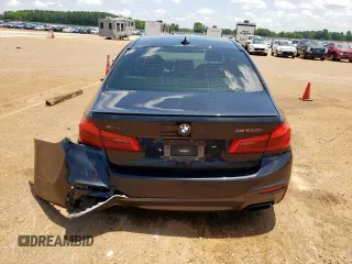 2018 BMW 5 Series M550i xDrive with VIN WBAJB9C54JB286450, listed as a Copart auction lot 61232125 with 88,479 mi miles and Salvage title. Bid and sale history available at DreamBid. Image 6.
