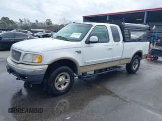 1999 Ford F-150 XL with VIN 1FTRX18LXXNA16159, listed as a IAAI auction lot 41746440 with 999,999 mi miles. Bid and sale history available at carsss.com. Image 2.
