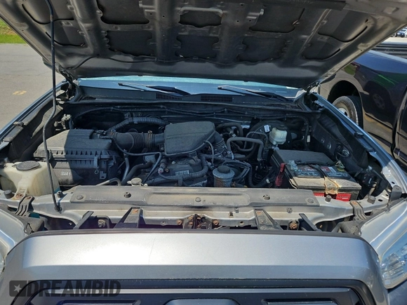 2018 Toyota Tacoma SR with VIN 5TFSX5EN6JX062775, listed as a IAAI auction lot 42774090 with 146,583 mi miles and . Bid and sale history available at DreamBid. Image 3.