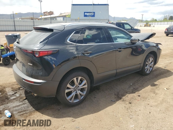 2023 Mazda CX-30 S Premium with VIN 3MVDMBDMXPM527113, listed as a Copart auction lot 57169165 with 49,040 mi miles and Salvage title. Bid and sale history available at DreamBid. Image 3.