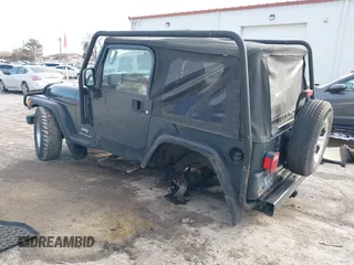 2005 Jeep Wrangler SE with VIN 1J4FA29S45P333916, listed as a IAAI auction lot 41214841 with 90,577 mi miles. Bid and sale history available at carsss.com. Image 3.