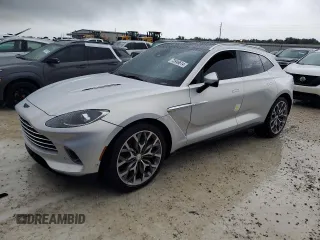 2021 Aston Martin DBX z VIN SCFVUJAW4MTV03930, wystawiony jako Copart lot #73946614 z przebiegiem Nie podano mil oraz Nie do naprawy. Historia ofert i sprzedaży dostępna na DreamBid. Obrazek 1.