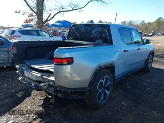2022 Rivian R1T Adventure Package with VIN 7FCTGAAA1NN012328, listed as a IAAI auction lot 41307929 with 13,588 mi miles. Bid and sale history available at carsss.com. Image 4.