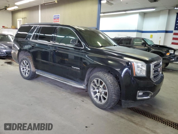 2015 GMC Yukon SLE with VIN 1GKS2AKC6FR229744, listed as a Copart auction lot 88270295 with 215,762 mi miles and Salvage Title. Bid and sale history available at DreamBid. Image 4.