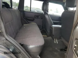 1999 Jeep Cherokee Sport with VIN 1J4FF68S9XL635836, listed as a Copart auction lot 59573195 with 187,035 mi miles and Salvage title. Bid and sale history available at DreamBid. Image 11.