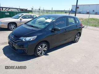 2016 Honda Fit EX with VIN JHMGK5H74GX042436, listed as a IAAI auction lot 42227520 with 106,777 mi miles and . Bid and sale history available at DreamBid. Image 2.