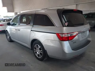 2012 Honda Odyssey EX-L with VIN 5FNRL5H67CB005013, listed as a IAAI auction lot 42295586 with 200,611 mi miles and . Bid and sale history available at DreamBid. Image 3.