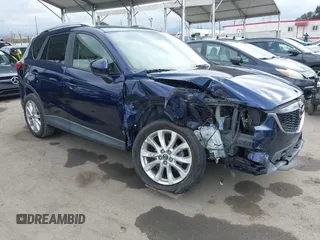 2014 Mazda CX-5 Grand Touring with VIN JM3KE2DY1E0307911, listed as a IAAI auction lot 42064898 with 133,934 mi miles. Bid and sale history available at carsss.com. Image 1.