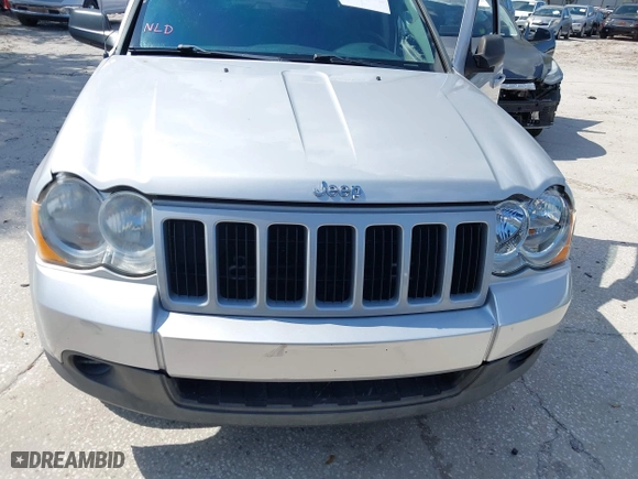 2010 Jeep Grand Cherokee Laredo with VIN 1J4PS4GK3AC163307, listed as a IAAI auction lot 41681527 with 155,464 mi miles. Bid and sale history available at carsss.com. Image 6.