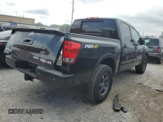 2015 Nissan Titan Pro-4X with VIN 1N6BA0EC1FN507894, listed as a Copart auction lot 65784274 with 147,576 mi miles and Salvage title. Bid and sale history available at DreamBid. Image 3.